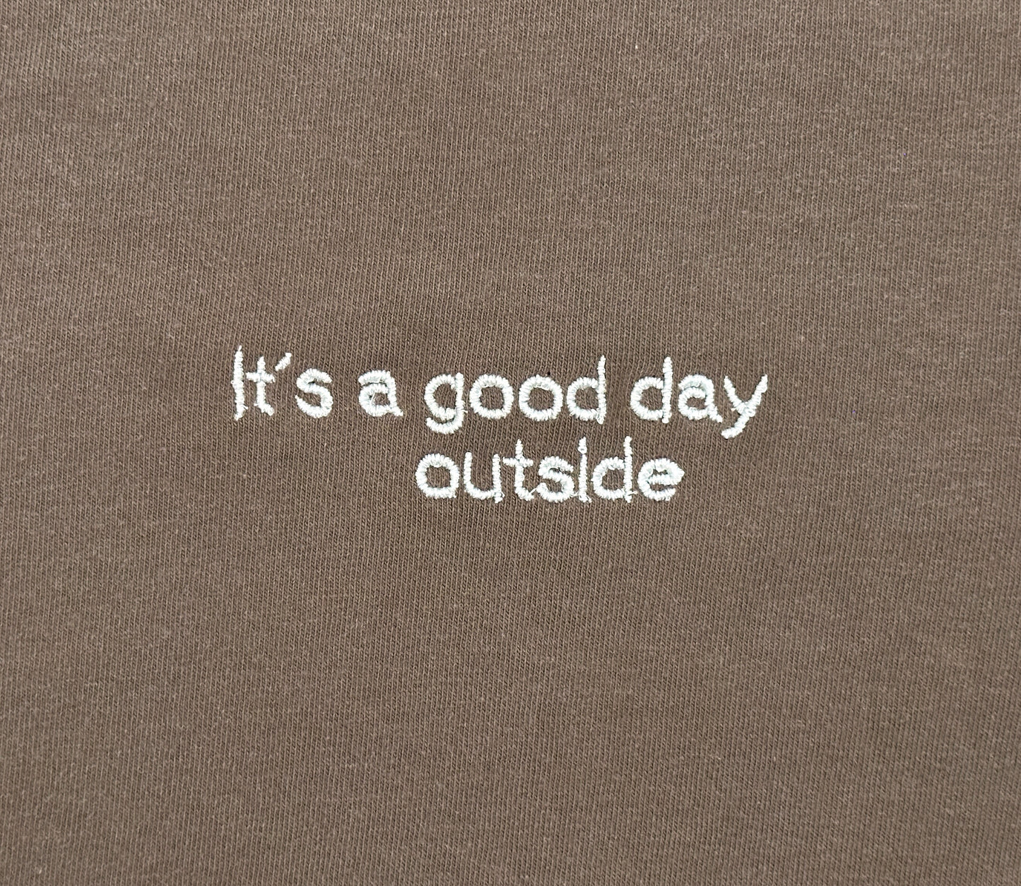 It’s a Good Day Outside embroidered shirt by Broider, front flat lay. Positive cotton tee made in Boston, creative original design.