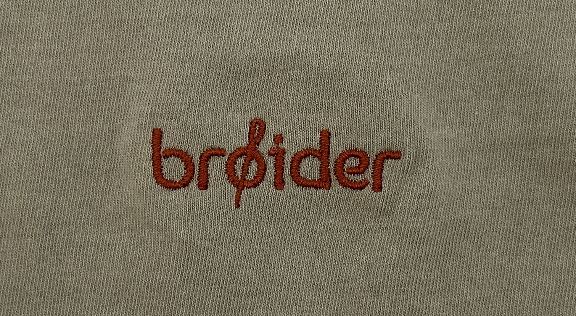 Close-up of Van Life embroidery on cotton shirt by Broider. Detailed stitching, Boston-made, small-batch creative apparel.