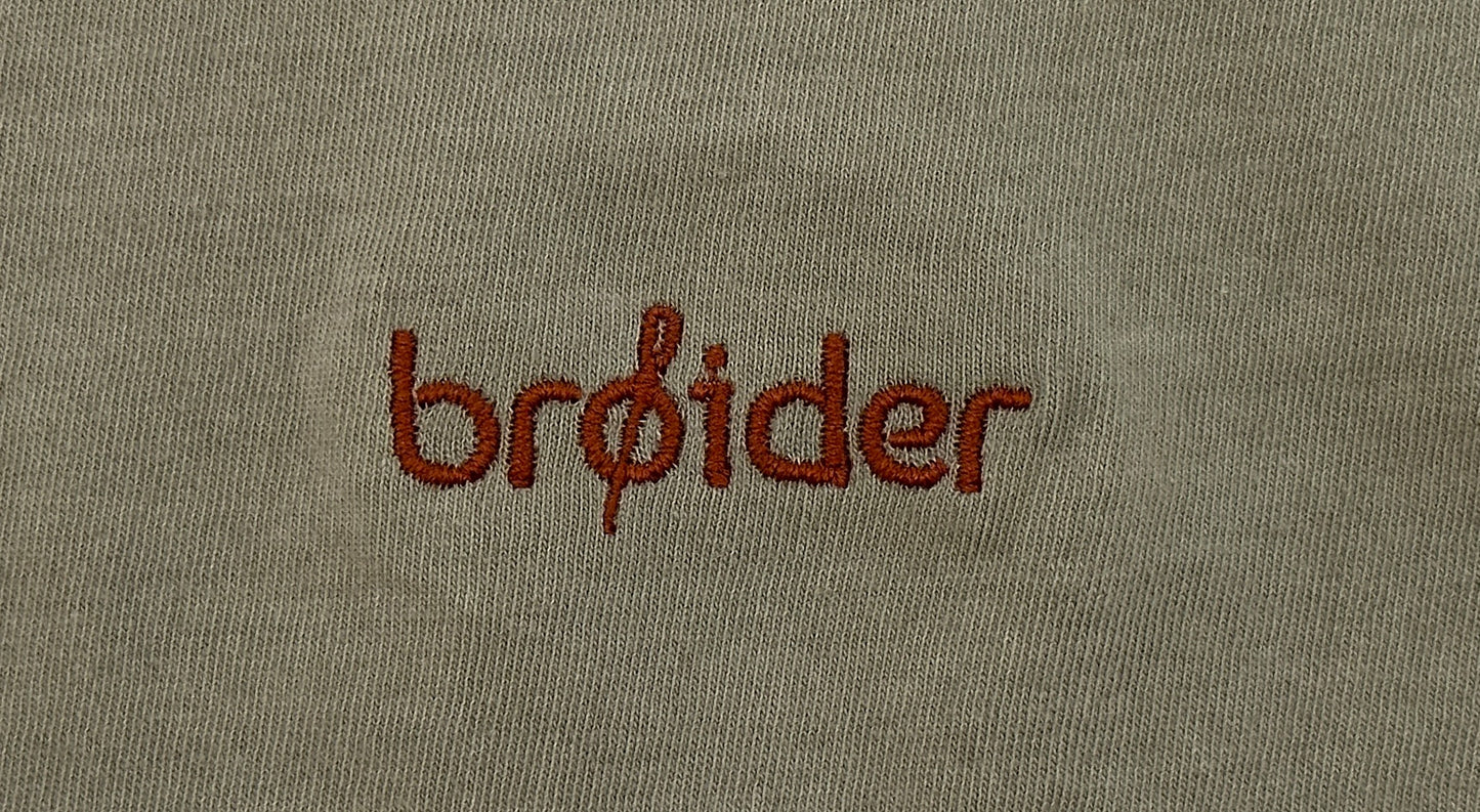 Close-up of Van Life embroidery on cotton shirt by Broider. Detailed stitching, Boston-made, small-batch creative apparel.