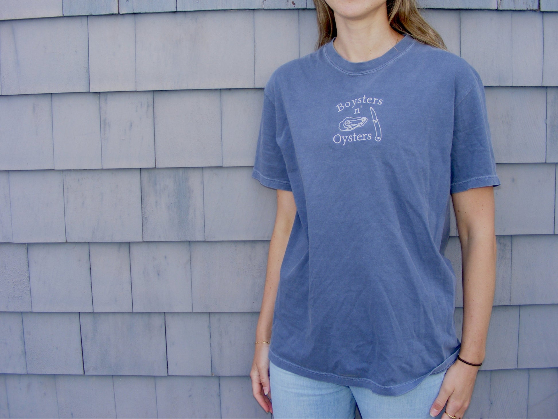 Model wearing Boysters ‘N Oysters shirt by Broider. Funny coastal embroidered tee for seafood lovers, crafted in Boston.