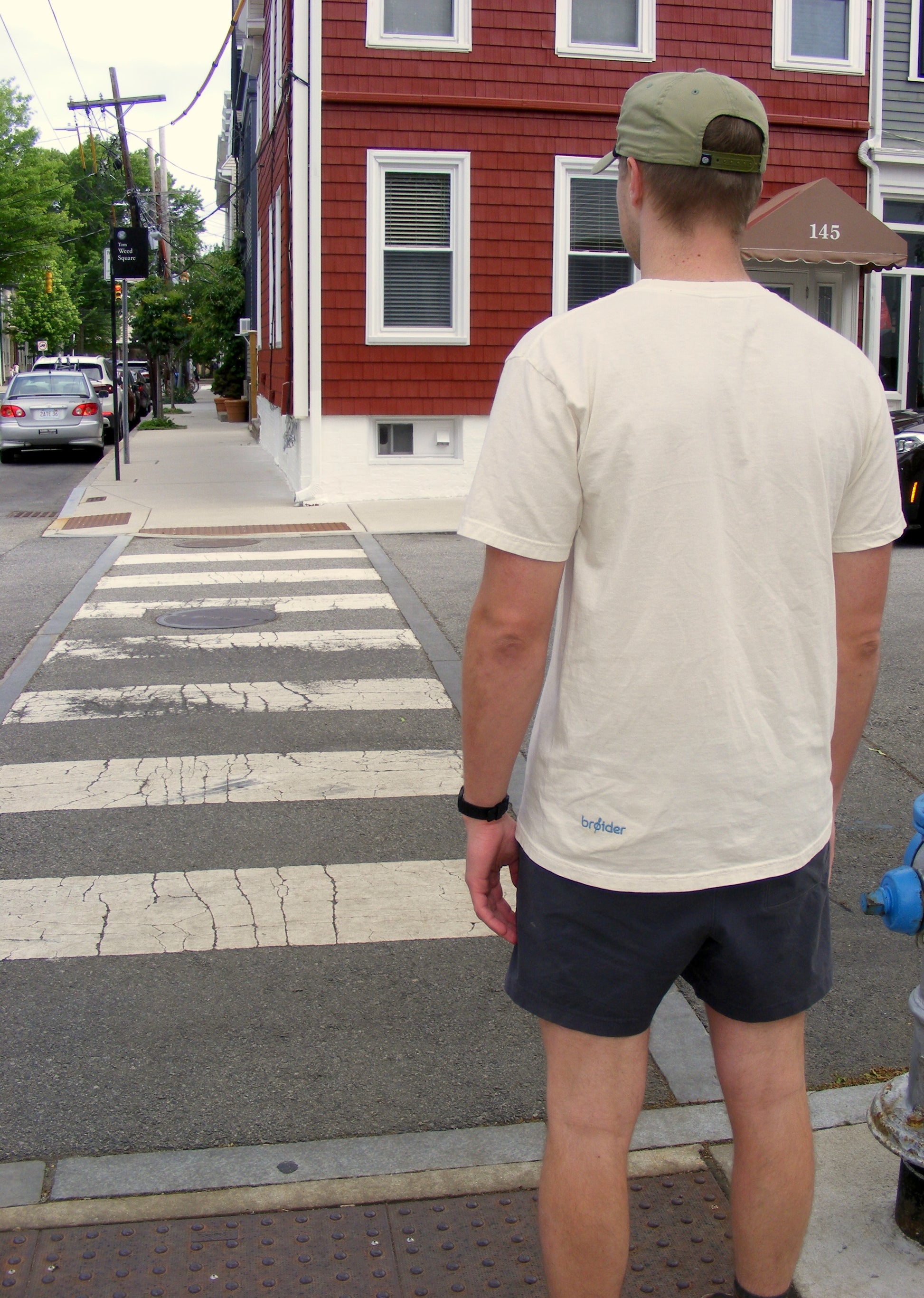 Model wearing It’s a Good Day Outside shirt by Broider. Positive embroidered shirt for everyday wear, stitched in Boston.