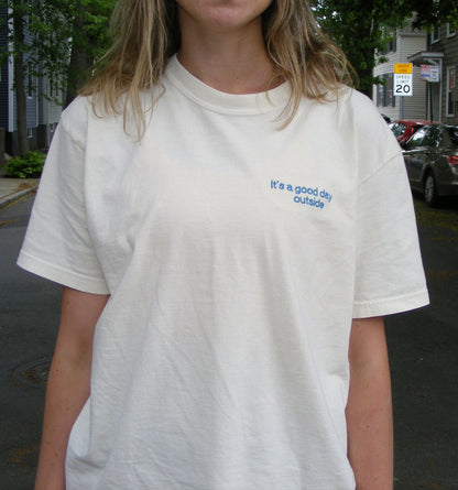Model wearing It’s a Good Day Outside shirt by Broider. Positive embroidered shirt for everyday wear, stitched in Boston.